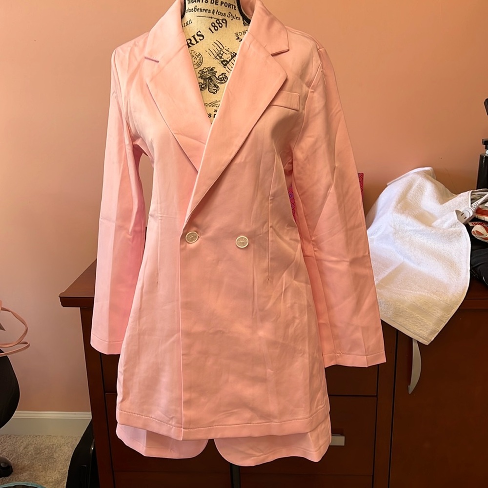 New without tags two piece suit size small, fits size 4